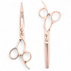 Complete Ichiro Rose Gold Sword professional scissors set showing cutting and thinning scissors with titanium coating