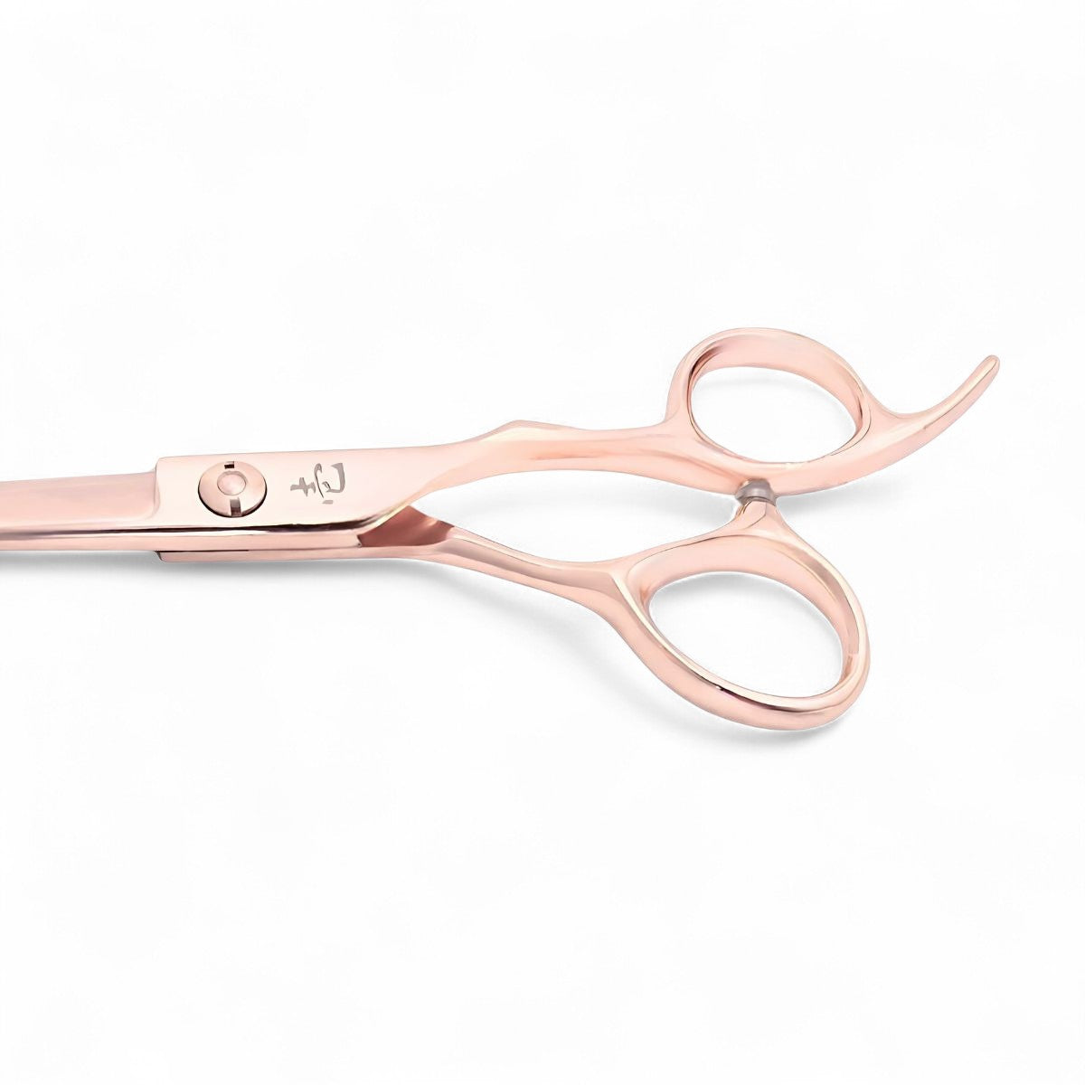 A close up of the Ichiro light Rose Gold Japanese hair cutting scissor handle