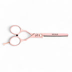 Side angle view of Mina Classic pastel pink scissors displaying symmetric handle design